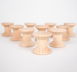 Carretes de madera para juego heurístico