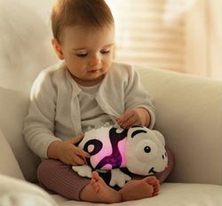 Peluche sensorial luminoso y sonoro Camaleón
