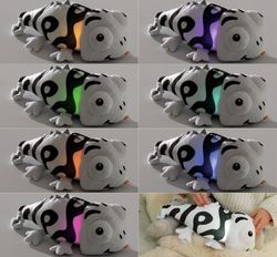 Peluche sensorial luminoso y sonoro Camaleón